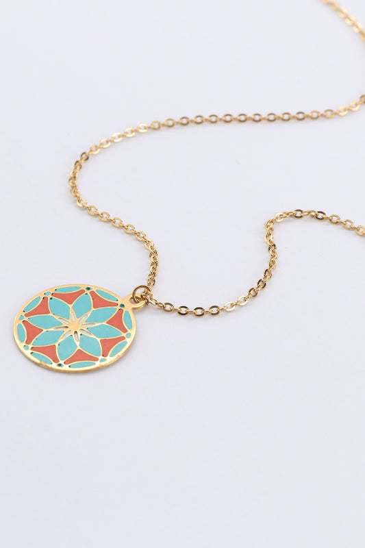 gold floral pendant necklace close up