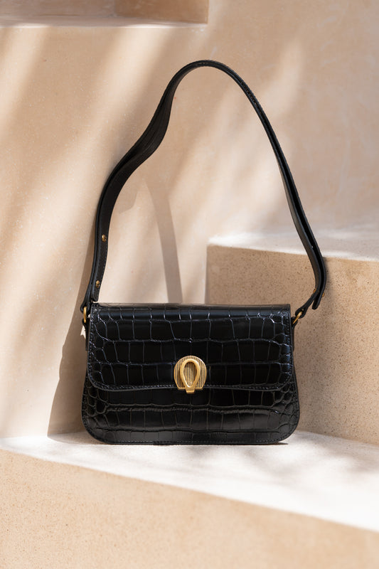 a black croc embossed leather shoulder bag