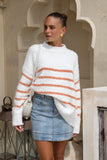 woman wearing a white knit sweater with orange stripe woman wearing a white knit sweater with orange stripe
