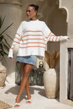 woman wearing white knit sweater with orange stripes woman wearing white knit sweater with orange stripes