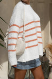 close up side view of white knit sweater with orange stripes close up side view of white knit sweater with orange stripes