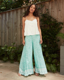 Woman wearing the jasmine white cami top Woman wearing the jasmine white cami top