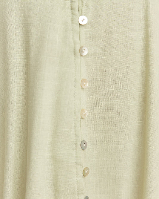 Close up of the umi green button down mini dress
