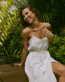 Woman wearing the valencia white button down midi tiered dress