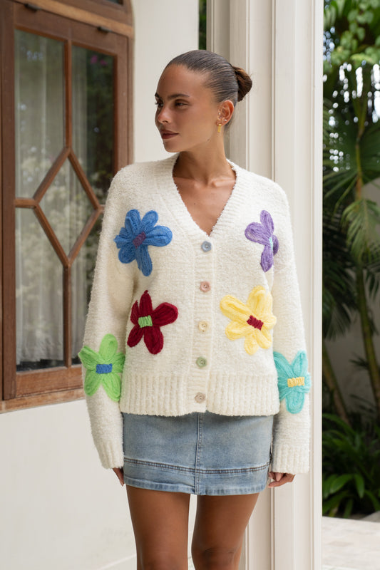 woman wearing knit cardigan with floral embroidery