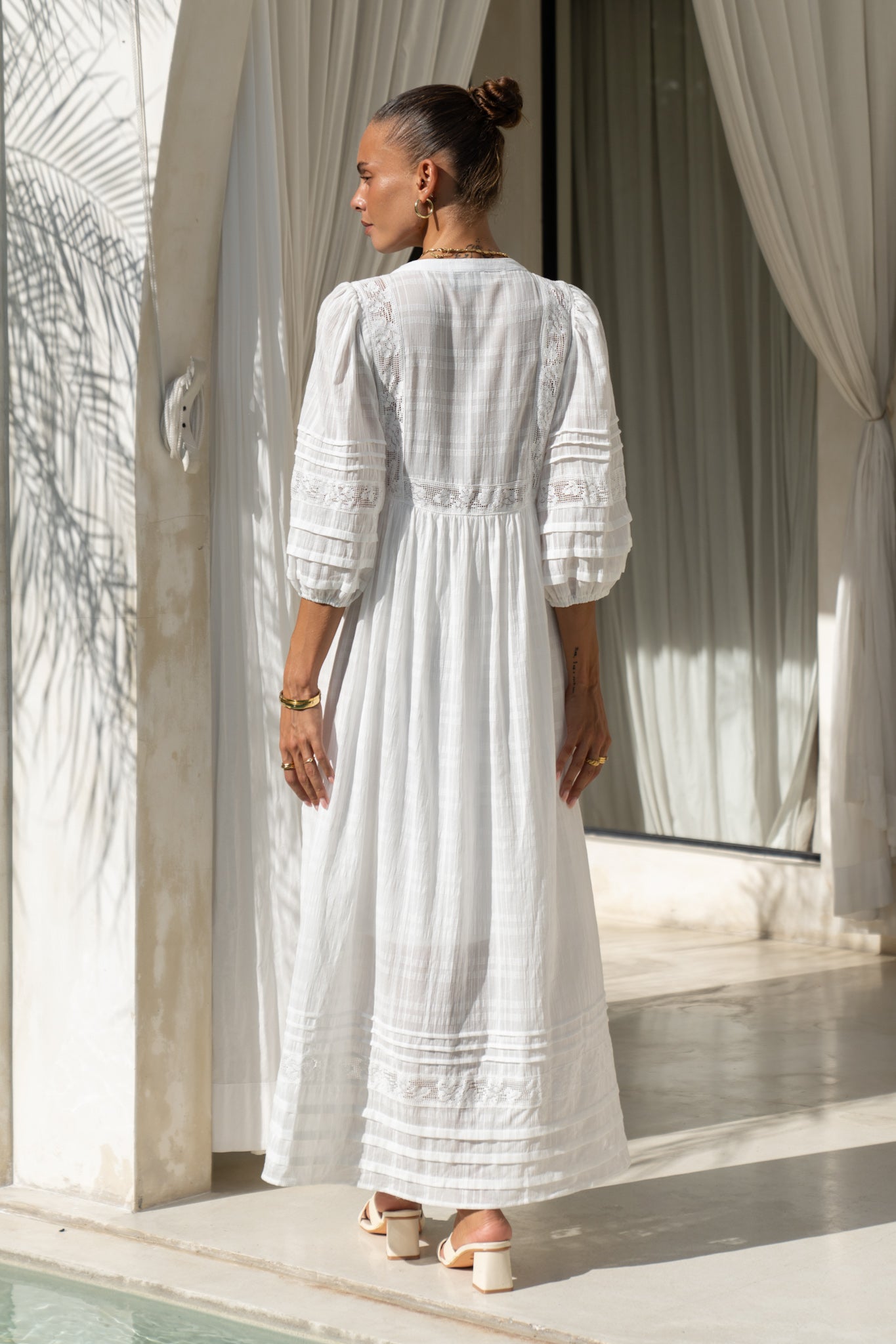 back view of white lace detail maxi dress