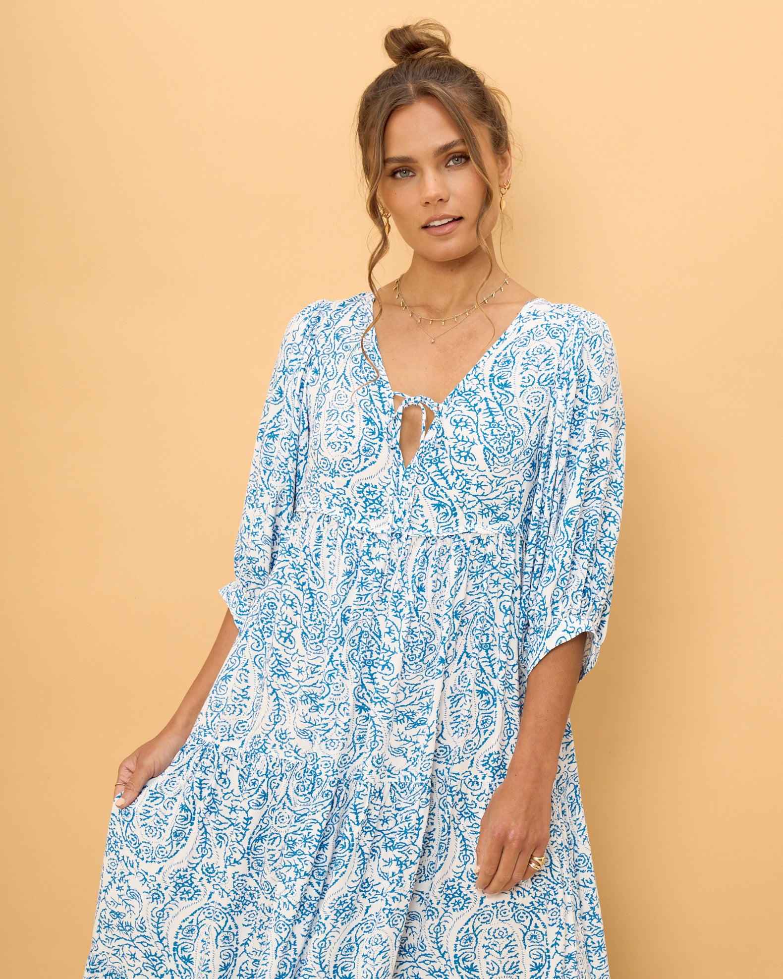 close up of women wearing a blue boho dress
