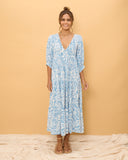 woman wearing a blue boho dress
