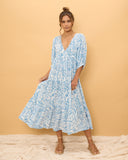 woman wearing a blue boho dress