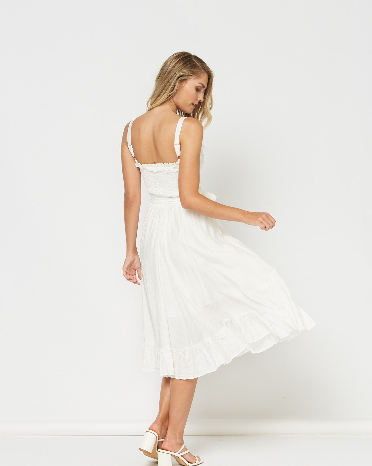Woman wearing the calista white midi dress