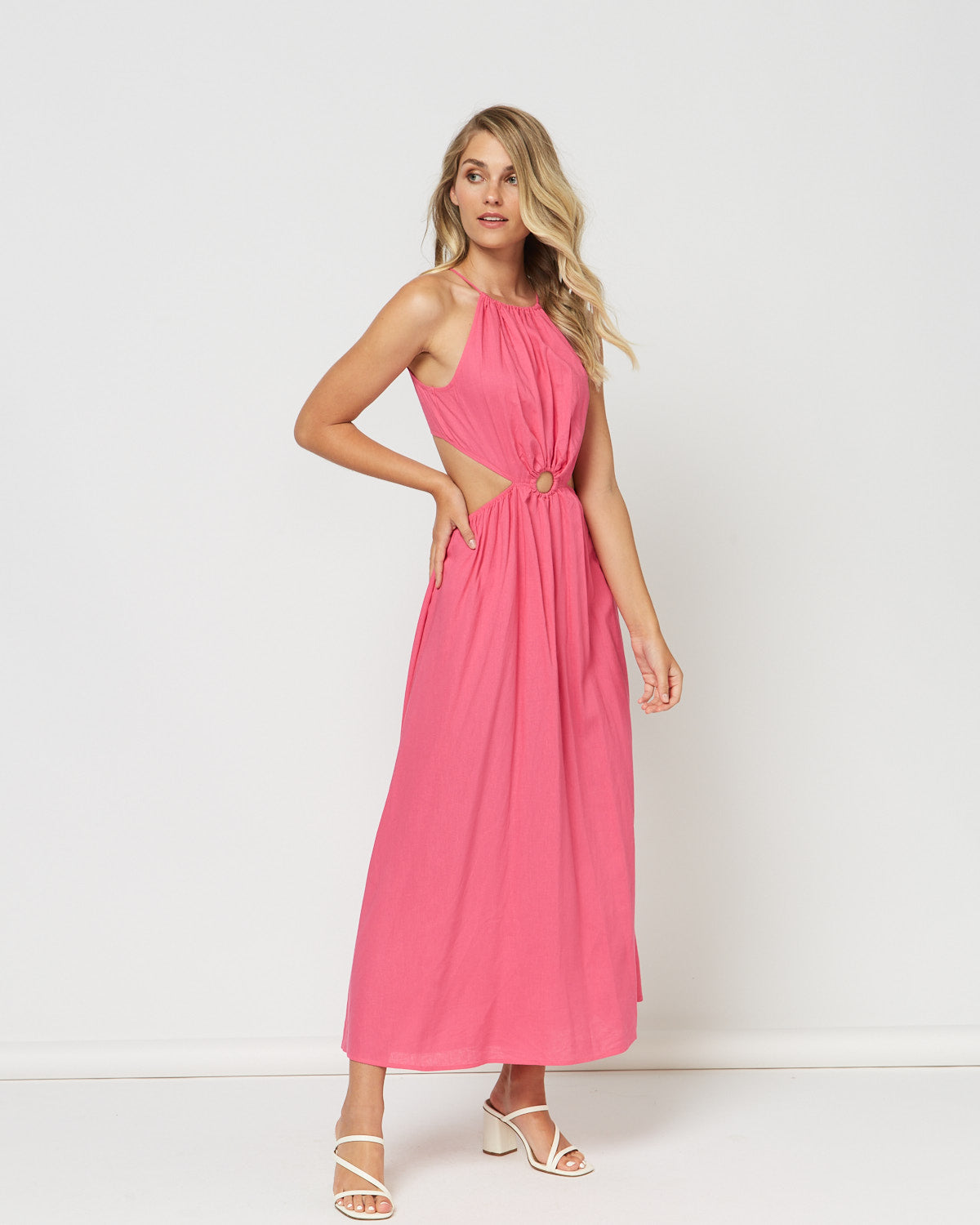 Woman wearing the candice pink high neck dress with cut out