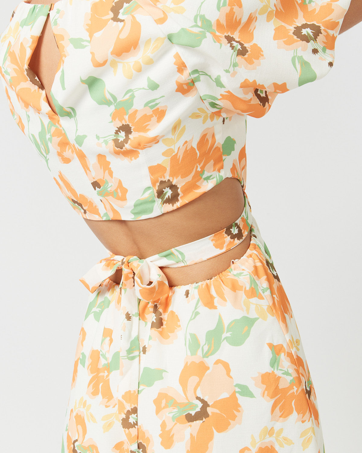 Close up of the chiara orange floral dress