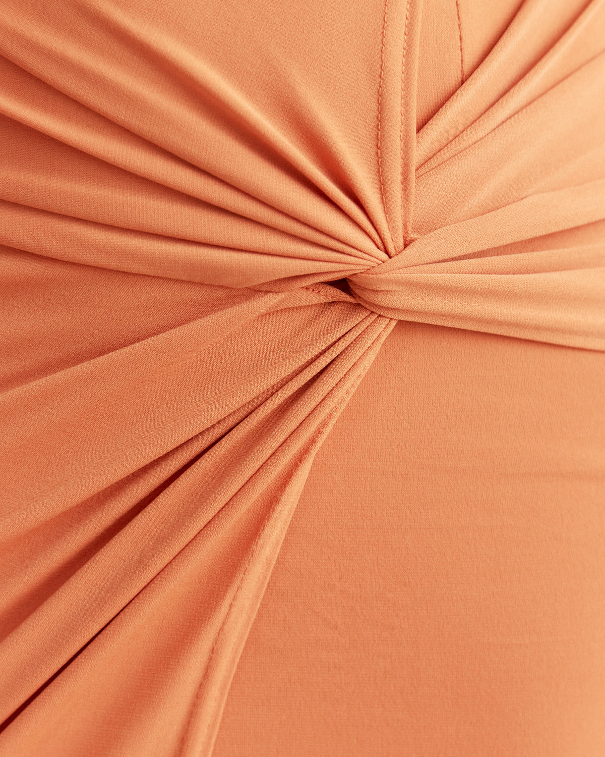 Close up of the dakota twisted orange mini dress