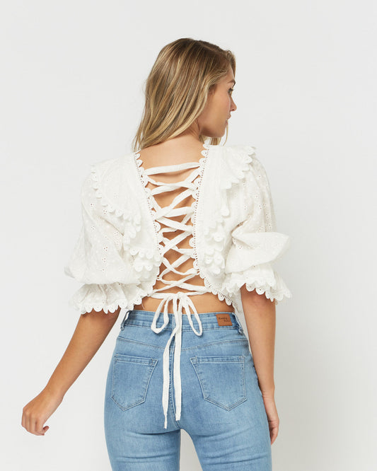Woman wearing the danni scallops broderie lace up open back crop top