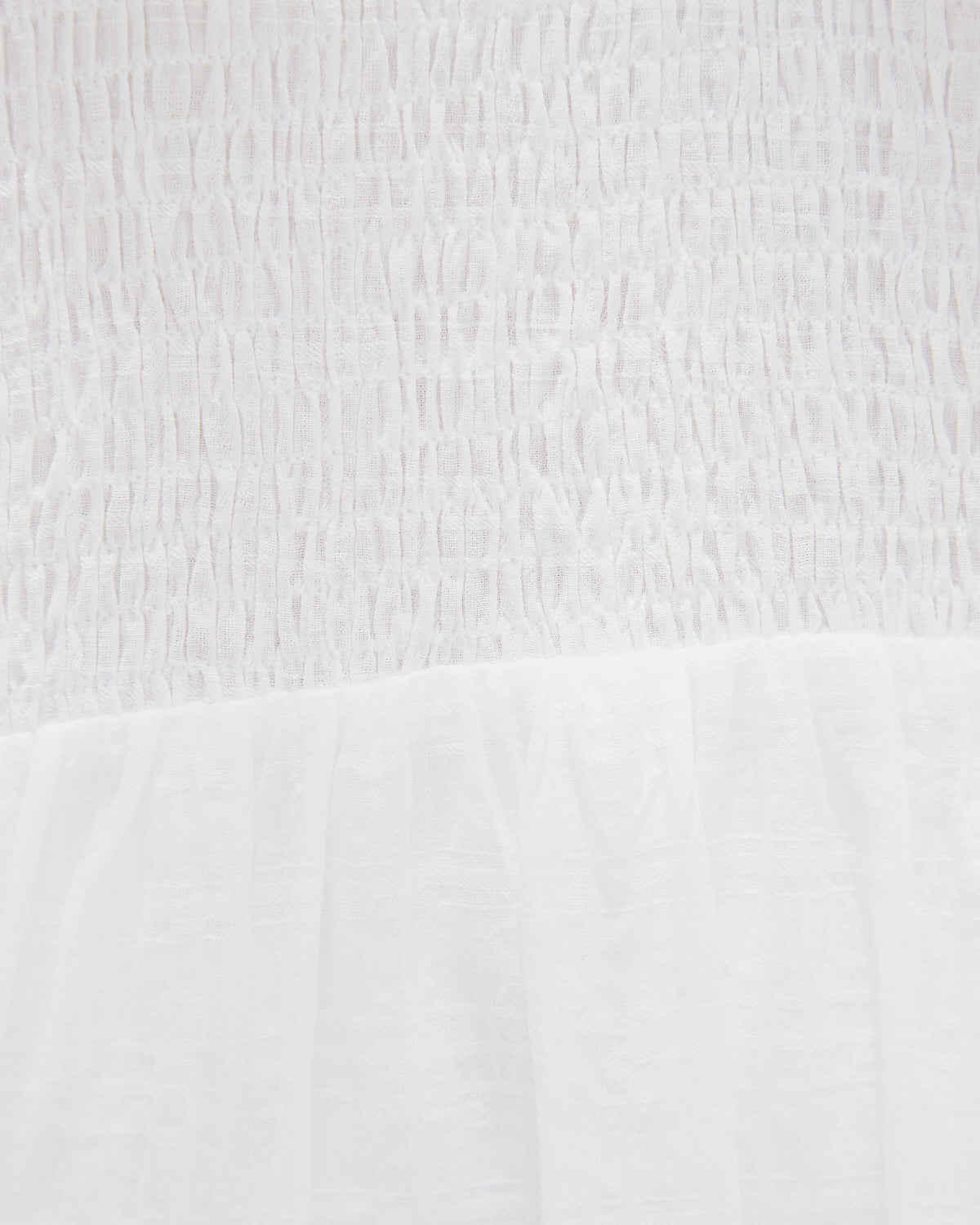 Close up of the everleigh white puff sleeves mini dress 