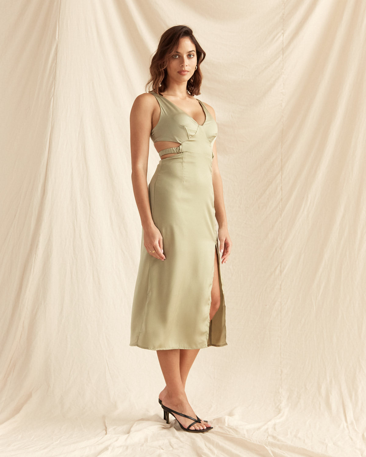 Woman wearing the gianna v neck waist cut out midi dress