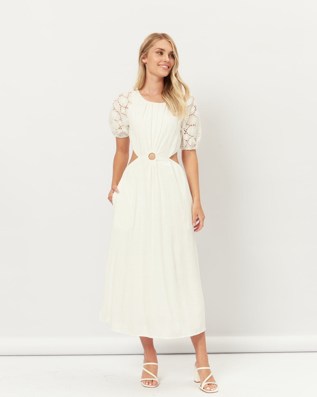 Woman wearing the hazel broderie puff sleeves cut out maxi dress