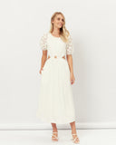 Woman wearing the hazel broderie puff sleeves cut out maxi dress