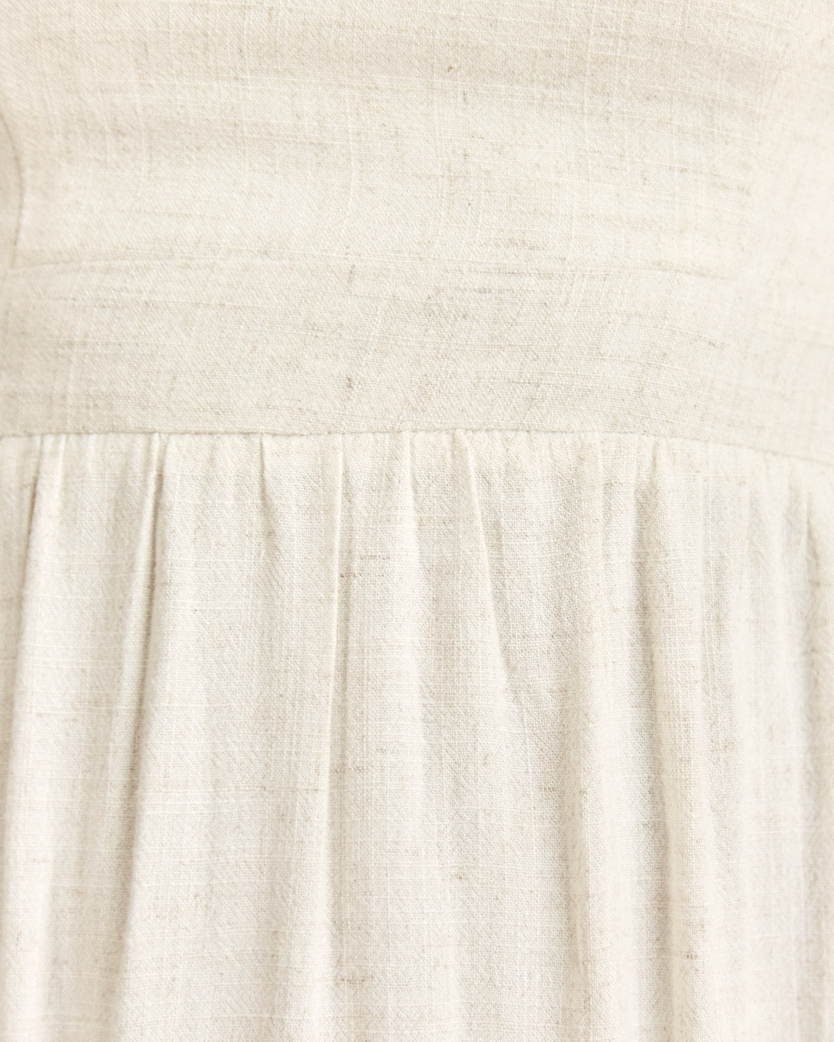 Close up of the isabelle beige linen cut out open back midi dress