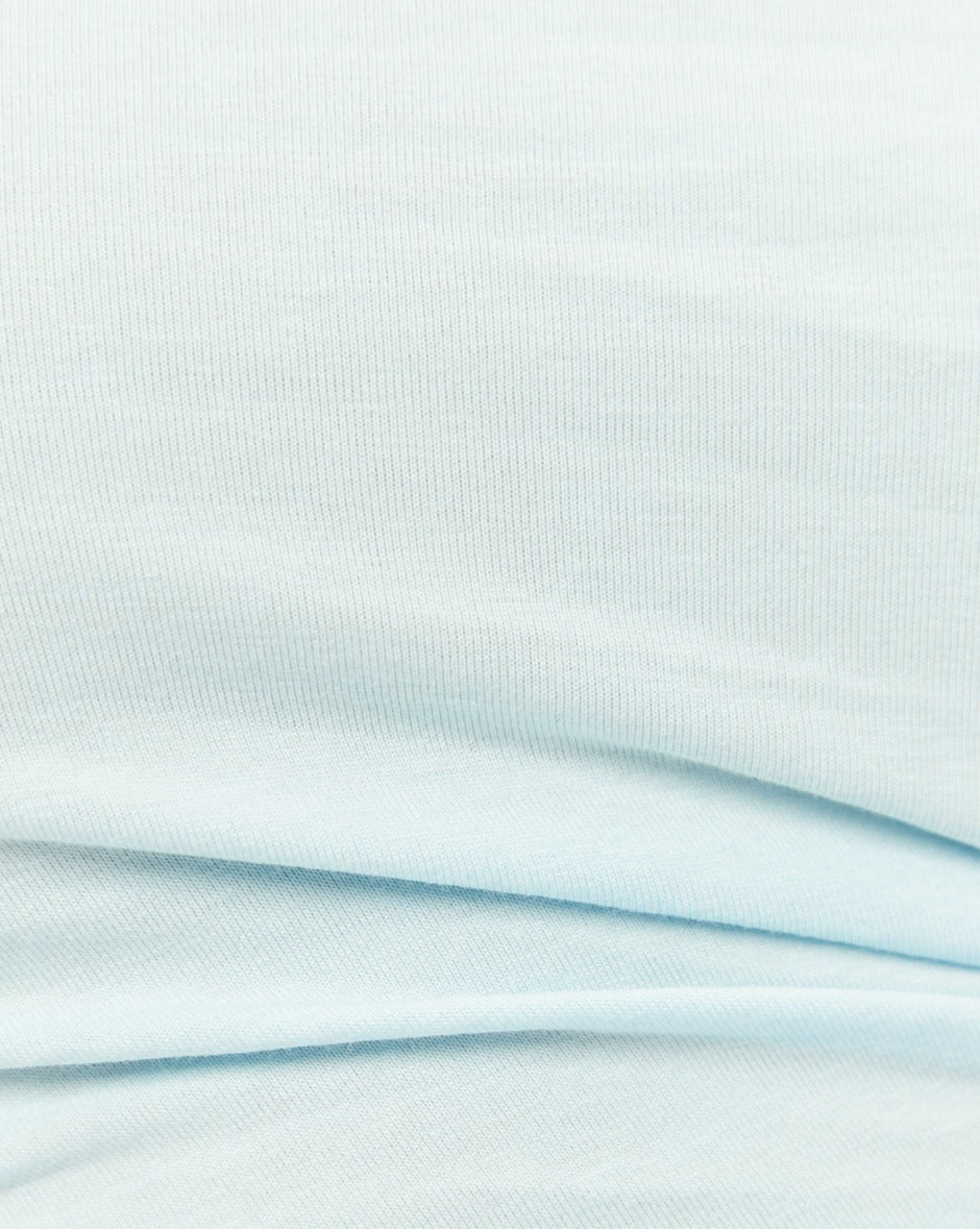 Close up of the itzel one shoulder blue top