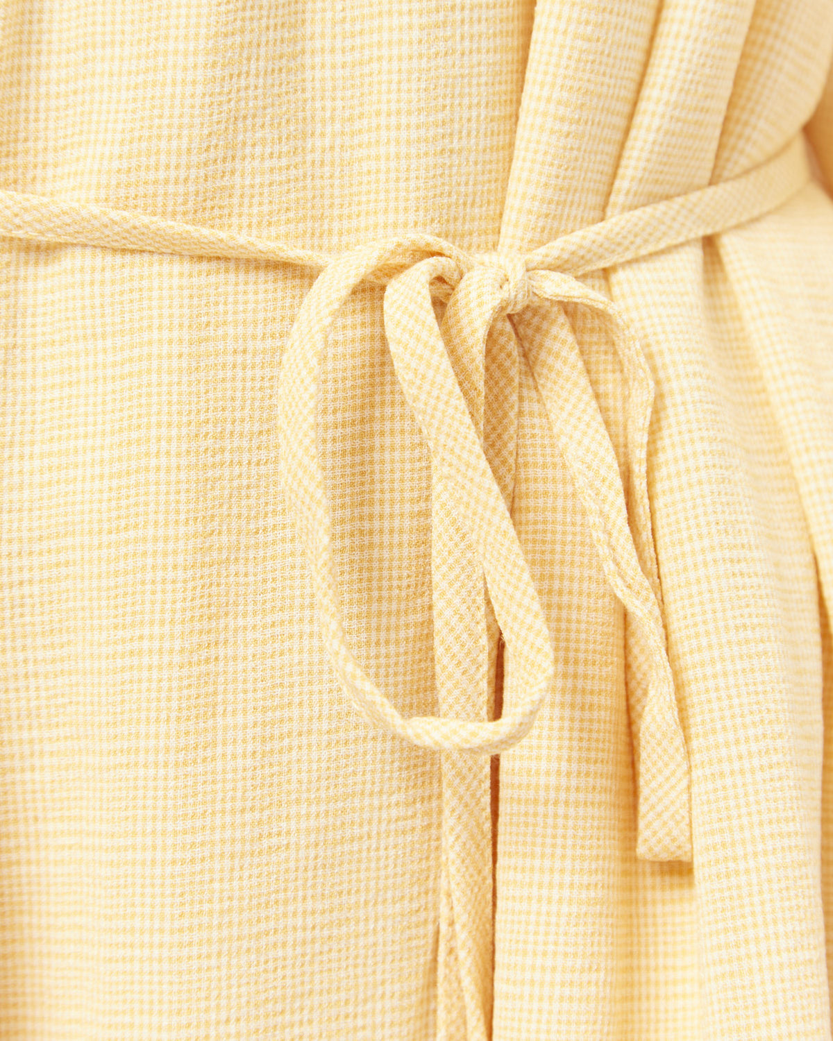 Close up of the ivanna off shoulder yellow mini dress