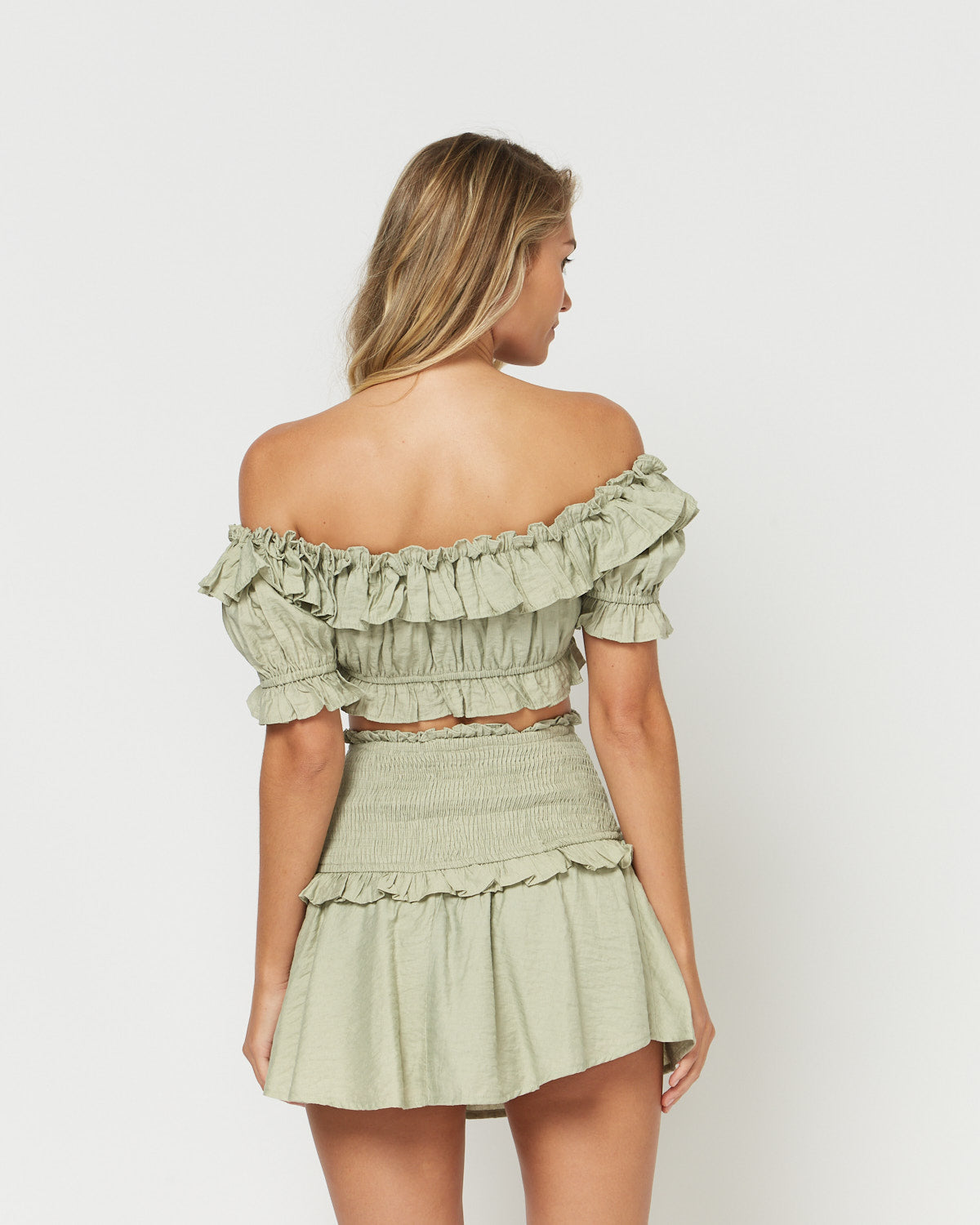 Woman wearing the josie green co ord shirred off shoulder crop top