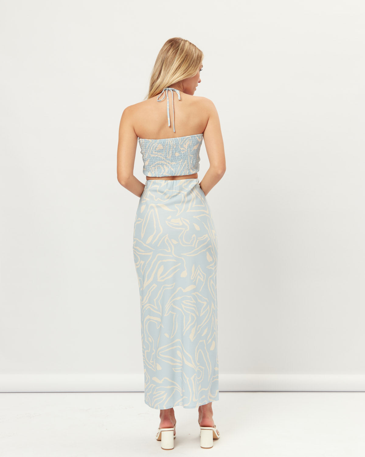 Woman wearing the kendall blue printed maxi skirt