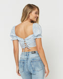 Woman wearing the laura blue lace up milkmaid crop top