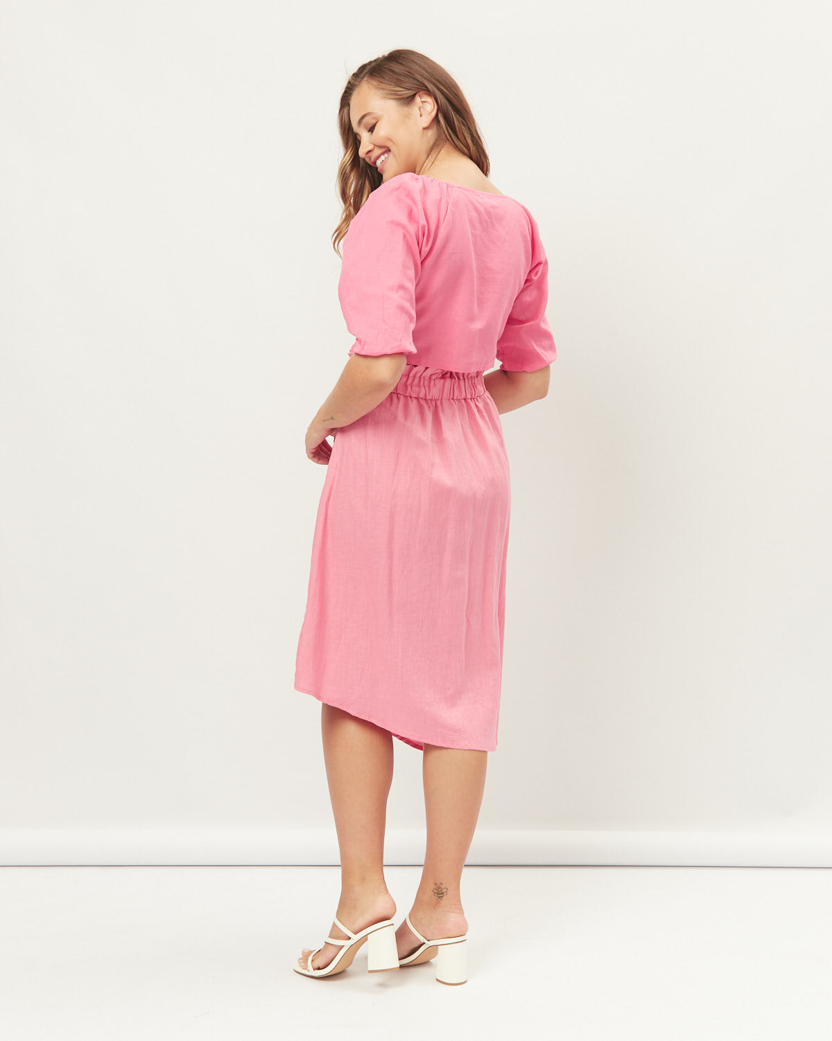 Woman wearing the layla pink asymmetrical midi skirt