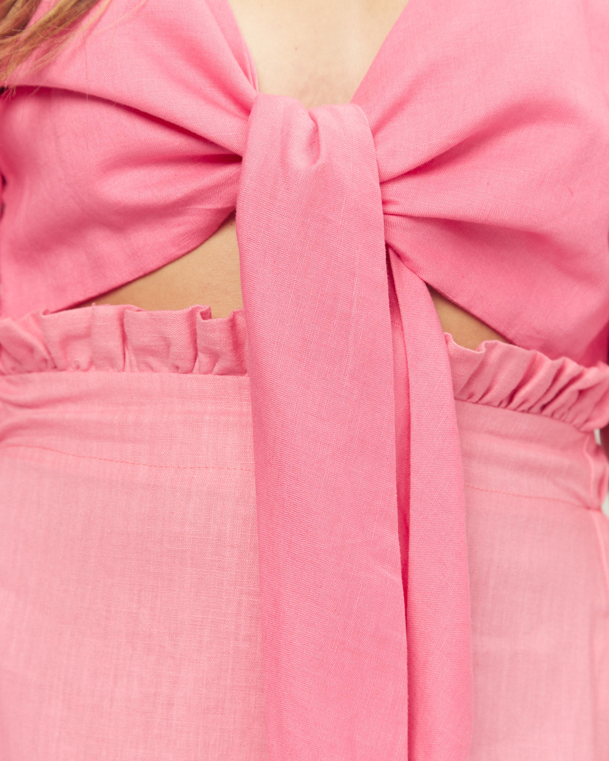 Close up of the layla pink asymmetrical midi skirt