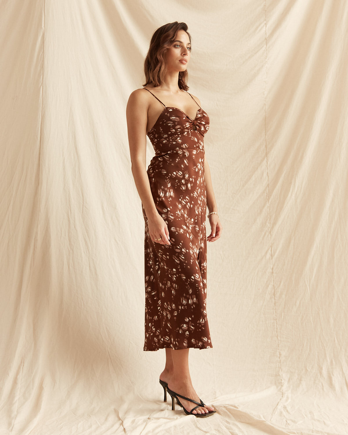 Woman wearing the lena brown print midi dress