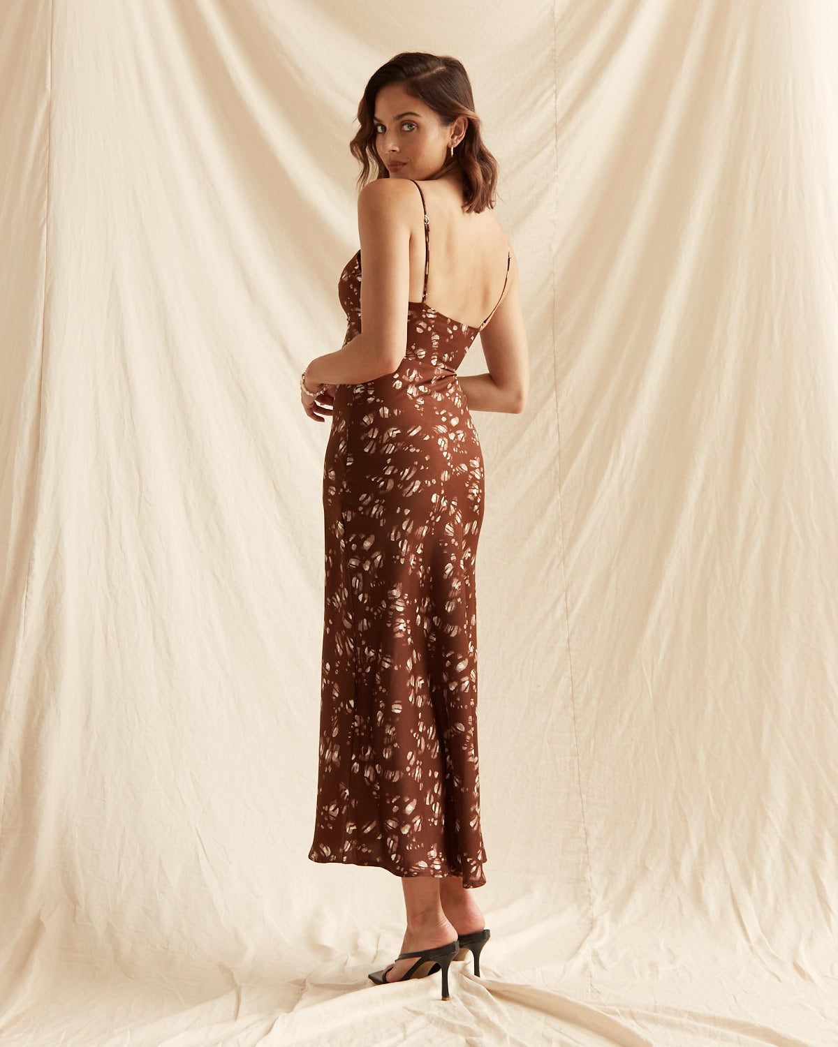 Woman wearing the lena brown print midi dress