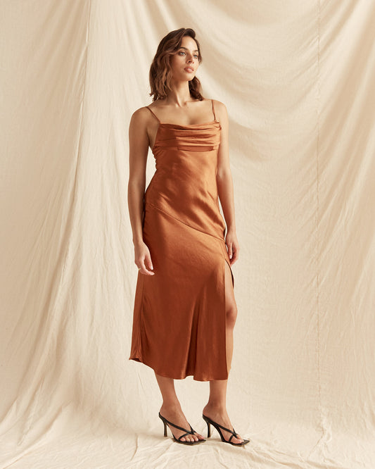Woman wearing the lucia brown satin ruched bust midi dress