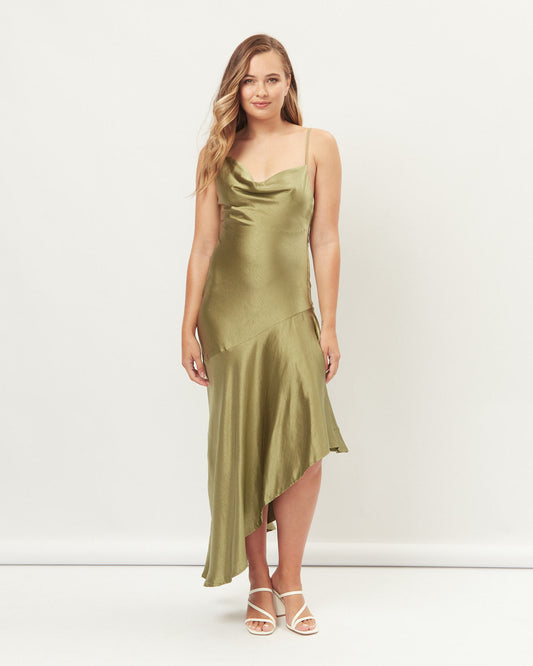 Woman wearing the nevaeh green asymmetric hem maxi dress