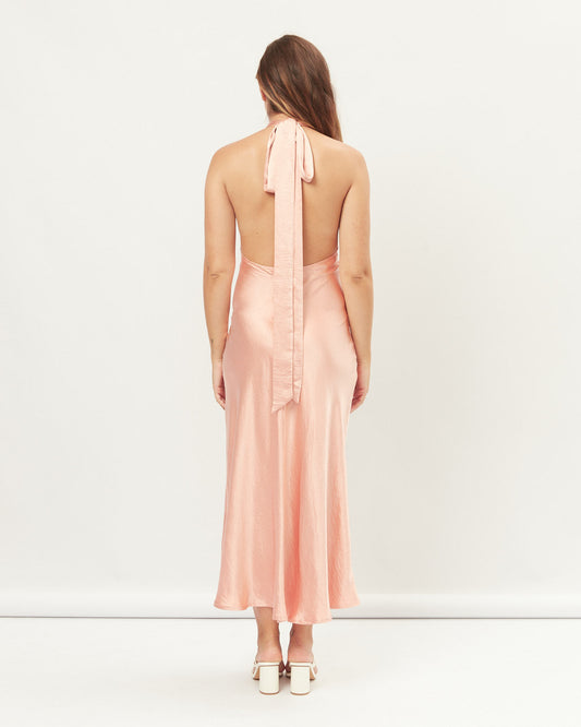 Woman wearing noelle pink halter midi dress