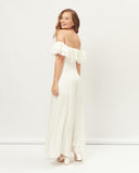 Woman wearing the oona white off shoulder jumpsuit