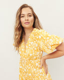 Woman wearing the paige yellow floral playsuit