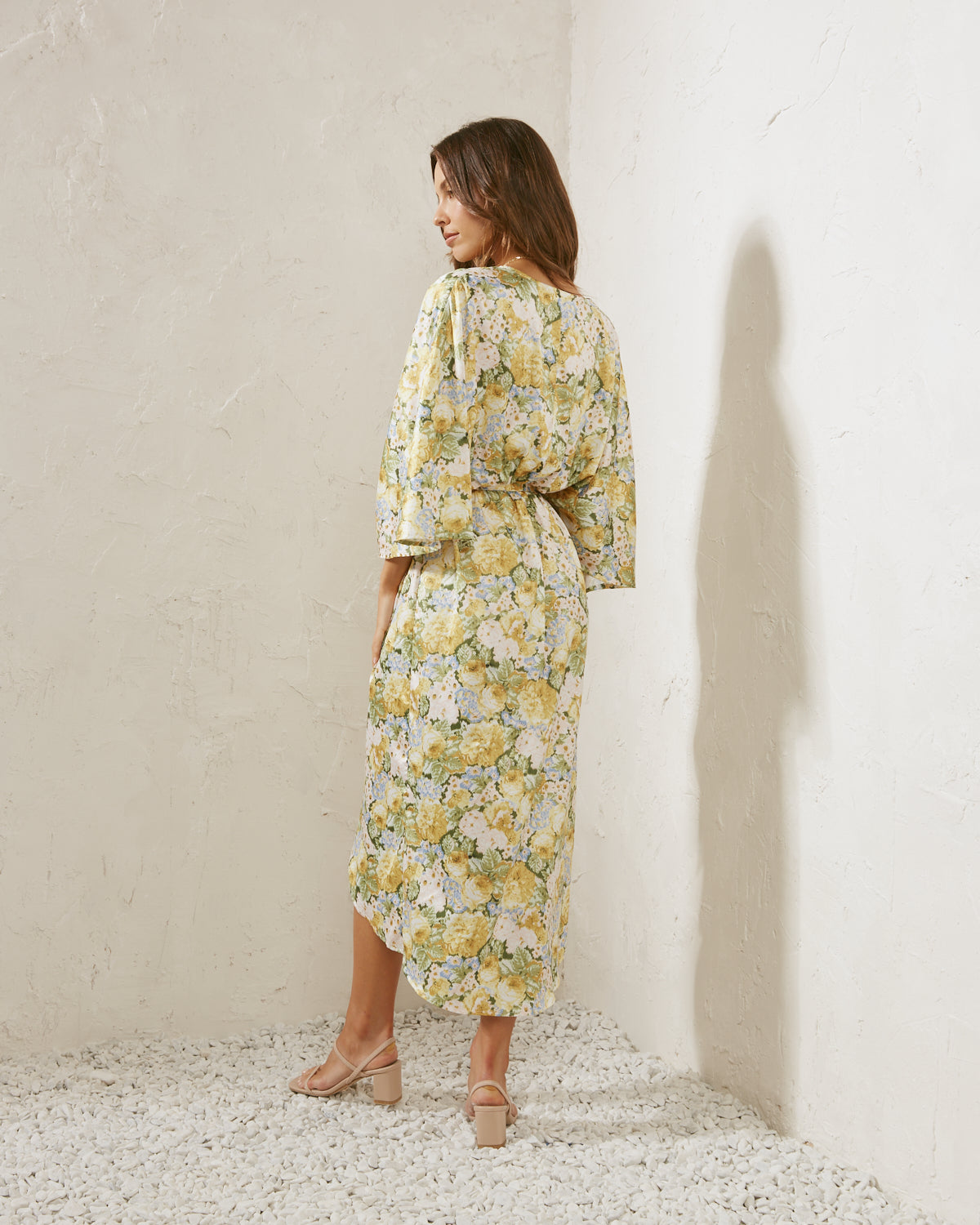 Woman wearing the reina wide sleeves floral midi dress