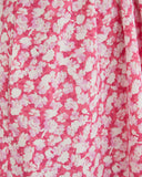 Close up of the tessa one shoulder pink floral mini dress