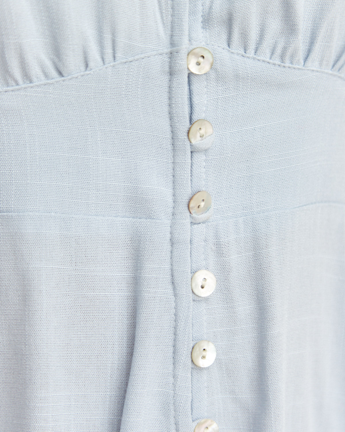 Close up of the ulyana blue button down mini dress