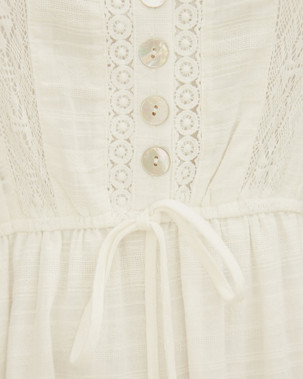 Close up of the valencia white button down midi tiered dress