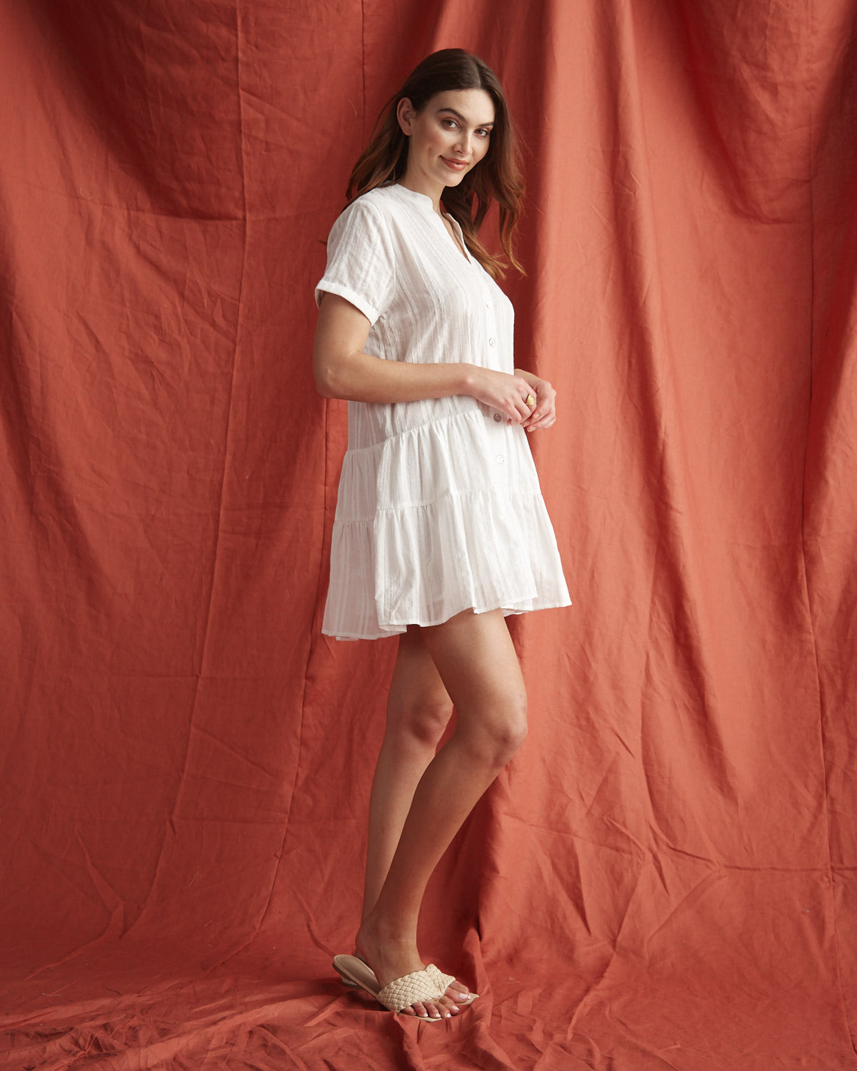Woman wearing the valeria white button down mini dress 