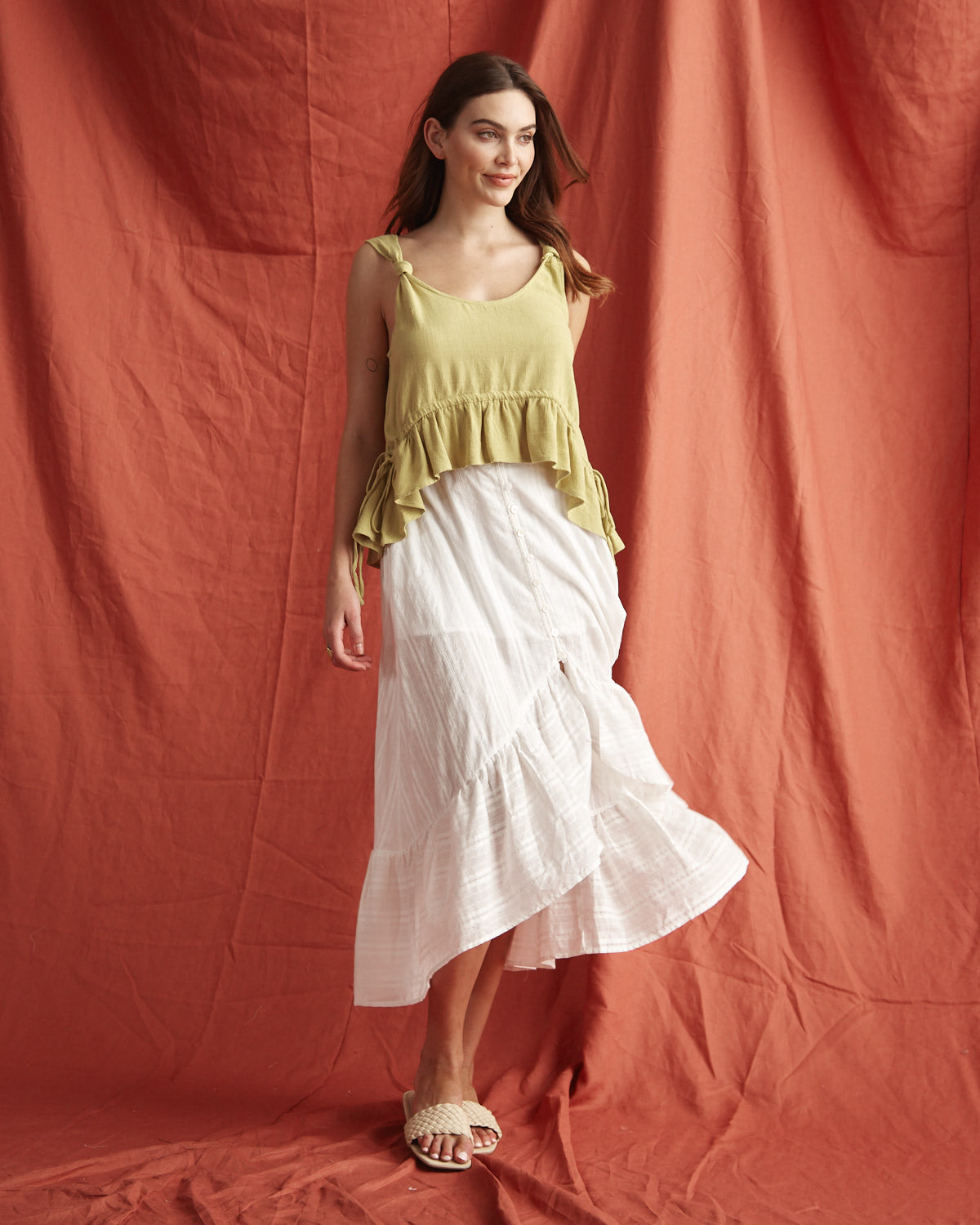 Woman wearing the veda green linen top