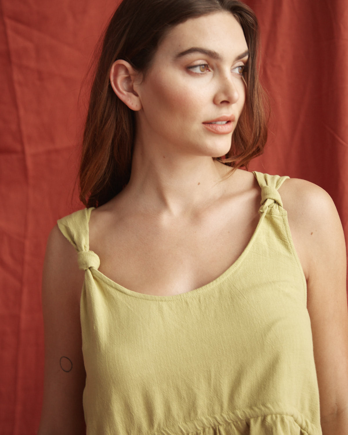 Close up of the veda green linen top