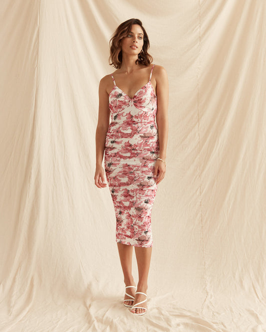 Woman wearing the xitlali pink floral bodycon midi dress