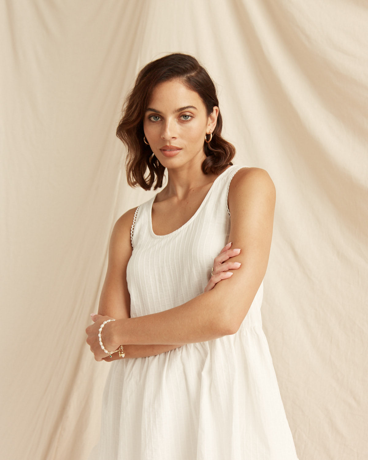 Woman wearing the xyla white mini dress