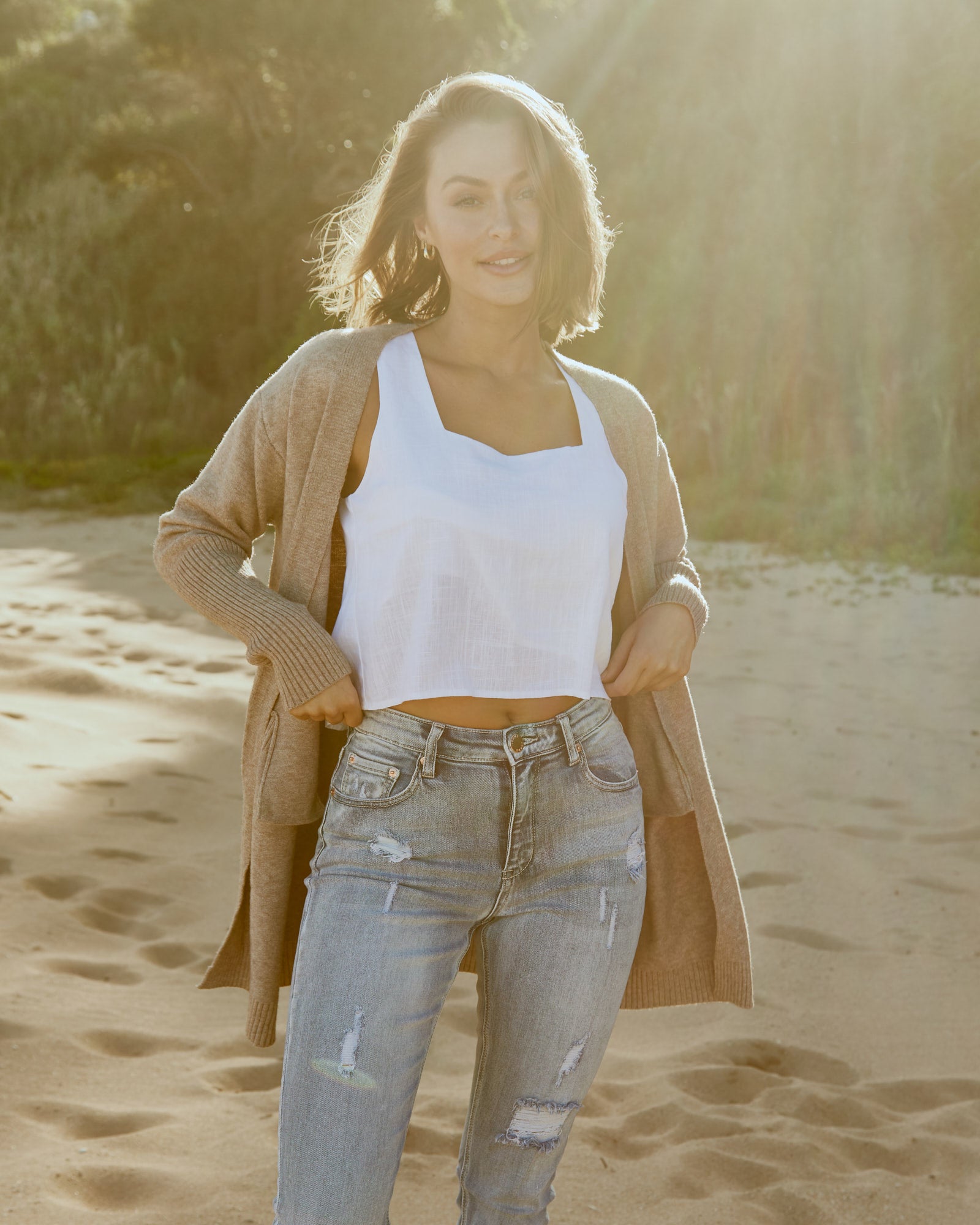 Woman wearing zoie sand cardigan at the beach